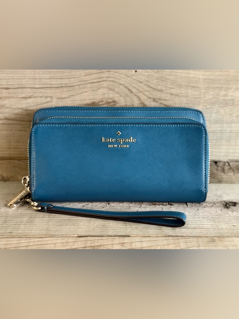 kate spade Staci teal blue wristlet clutch with gold logo